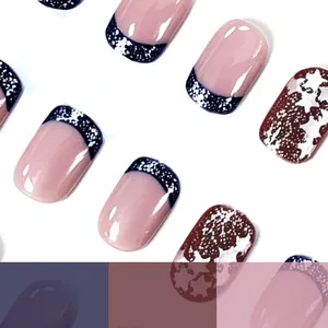Short square press-on nails set featuring navy blue French tips and sparkling star patterns