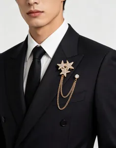 Detail of star brooch with rhinestones and double chains on black suit lapel