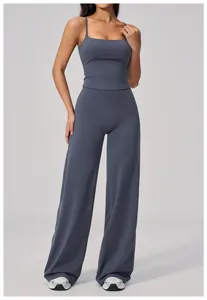 Detail view of high-waisted wide-leg yoga pants and thin strap camisole in grey blue
