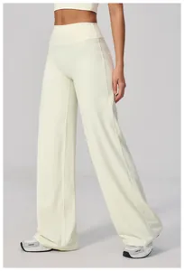 Detail showing the cream high-waisted wide-leg yoga pants with premium elastic fabric