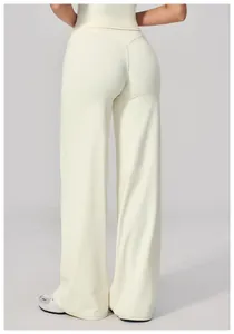 Rear view of high waisted wide leg yoga pants in cream white with V-shaped back seam