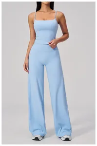 Close-up of light blue high-waisted wide-leg yoga pants and thin strap sports vest set