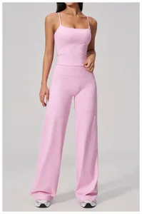 Close-up of pink high-waisted yoga pants and matching tank top for fitness