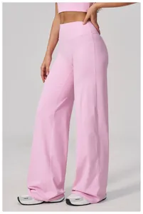 Detail view of pink high-waisted wide-leg yoga pants and matching tank top set
