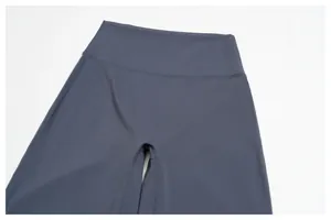 Close-up of high-waist elastic yoga pants showing double-needle flat-lock stitching