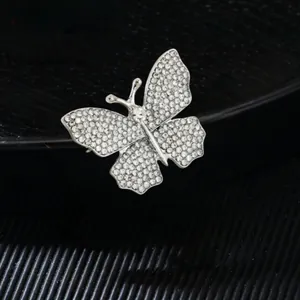 Elegant butterfly brooch with sparkling crystals and silver plated metal base
