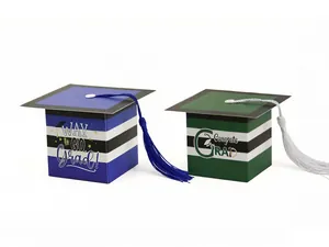 Close-up of graduation cap gift boxes with stripes, tassels and way to go grad text