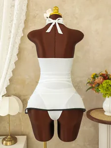 Detail of white halter neck swimsuit with black trim on ruffles and back tie closure