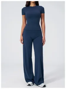Detail showing navy blue brushed fabric yoga set with short sleeve top and wide leg pants
