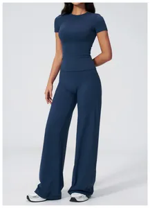 Detail view of navy blue high-waisted wide-leg yoga pants and fitted t-shirt set