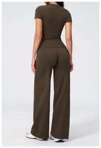 Rear view of brown high-waist yoga set with slim fit top and wide leg pants