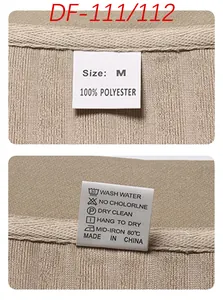 Detail of size M label and 100% polyester fabric texture on beige vertical striped set