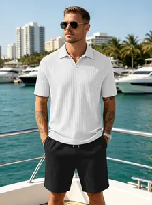 Detail of white V-neck ribbed polo shirt and black drawstring shorts on yacht deck