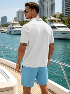 Close-up of men's ribbed knit polo and blue shorts set on a luxury yacht deck