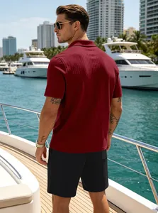 Detail of burgundy polo shirt with vertical stripe texture on a yacht deck