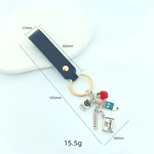 Teacher appreciation keychain with red apple, crayon box, and #1 Teacher silver tag