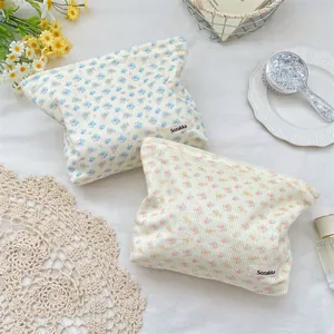 Detail of floral corduroy cosmetic bags set with vintage texture and Sozakka label