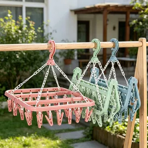 Foldable laundry hanger with multi-clips for drying socks and baby clothes in pink, green, and blue