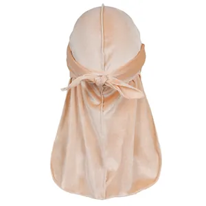 Detail showing the premium velvet texture and long tail design of champagne durag