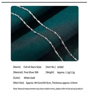 Macro view of 999 sterling silver starry chain necklace on green silk fabric