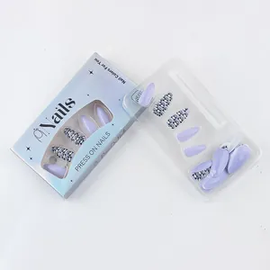 Short glossy press-on nails with cute panda print and purple finish in blue packaging