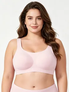 Detail of soft jelly-strip support and seamless light pink plus size bra for women