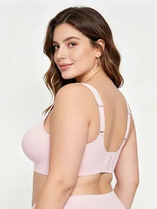 Macro detail of seamless bra showing adjustable straps and U-shaped back in pink