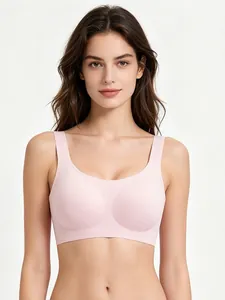 Detail of light pink seamless bra featuring wide straps and soft jelly support texture