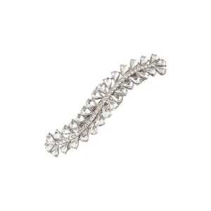 Close-up of wavy alloy hair clip with sparkling crystal rhinestones on white base