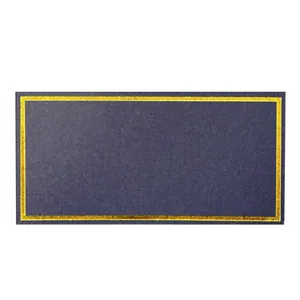 Macro shot of dark blue wedding place card with a luxury gold foil metallic border