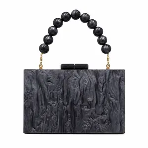 Chic marbled acrylic evening clutch with beaded wrist handle and gold metal hardware