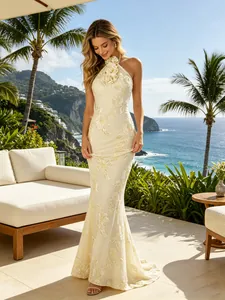 Elegant halter neck dress with 3D floral accents and embroidery in ivory white
