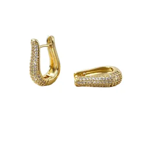 Detail of gold-plated U-shaped earrings with micro-pave cubic zirconia inlay