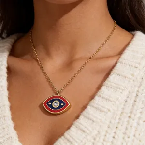 Detail of red and blue enamel evil eye pendant necklace with a center zircon stone