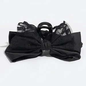 Elegant black satin and lace bow hair clip with heart embroidery and central claw