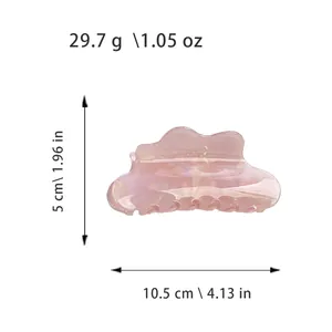 Iridescent mermaid pink hair claw clip with pearlescent finish and cloud-like wave design