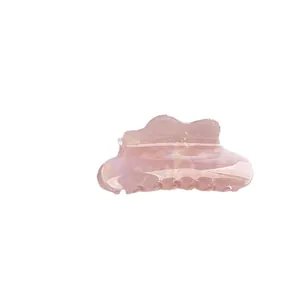 Iridescent mermaid pink cloud hair claw clip with a pearlescent finish and wave design