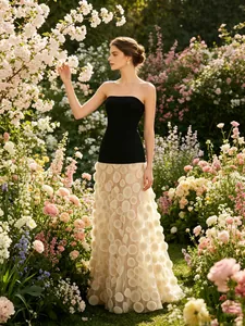 Elegant strapless black slim top paired with white 3D floral mesh maxi skirt in garden