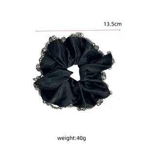 Detail of black satin hair scrunchie with grey beads and size measurement 13.5cm