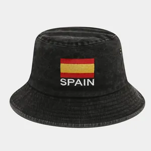 Close-up of Spain flag embroidery and metal eyelets on washed cotton bucket hat