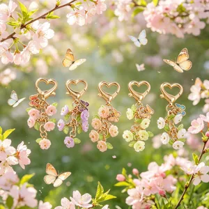 Floral butterfly keychains with heart-shaped golden lobster clasps in five vibrant colors