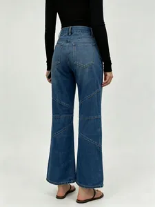 Detail of high-waisted wide-leg denim jeans with multi-diagonal stitching on the back