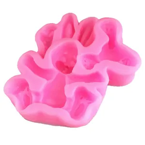 Pink silicone DIY baking mold featuring cute cartoon ghost shapes for Halloween cakes