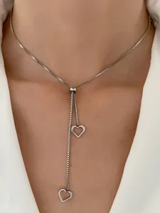 Silver adjustable heart pendant necklace with double heart charms on a box chain