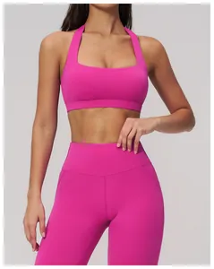 Gros plan du legging de yoga taille haute rose vif avec ceinture sculptante pour femme