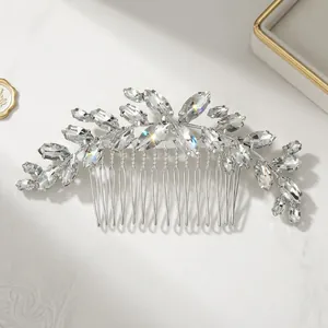 Silver bridal hair comb with marquise crystals in elegant floral design on marble
