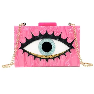Pink marble acrylic evening clutch with evil eye design and gold chain strap