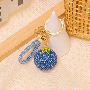 Portachiavi mirtillo con strass blu, cinturino intrecciato e anello in metallo oro