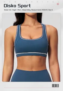 Detail view of navy sports bra with white contrast stitching and model size info