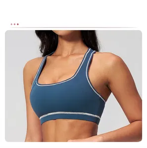 Detail view of contrast stitch sports bra featuring convenient removable padding